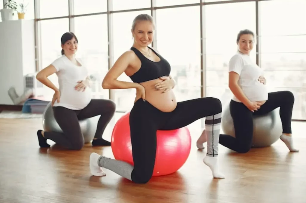 Pregnant women doing yoga in a gym